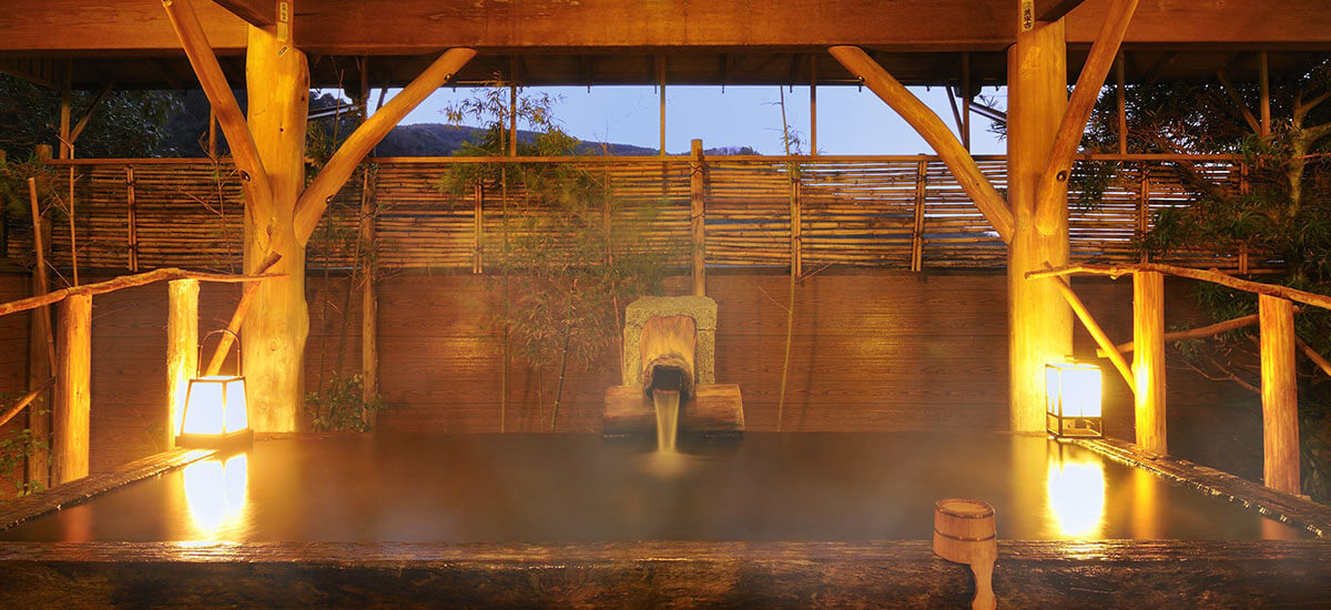 The giant-tree bath at Shirakabe, carved from a single 1,200-year-old tree and lit at night