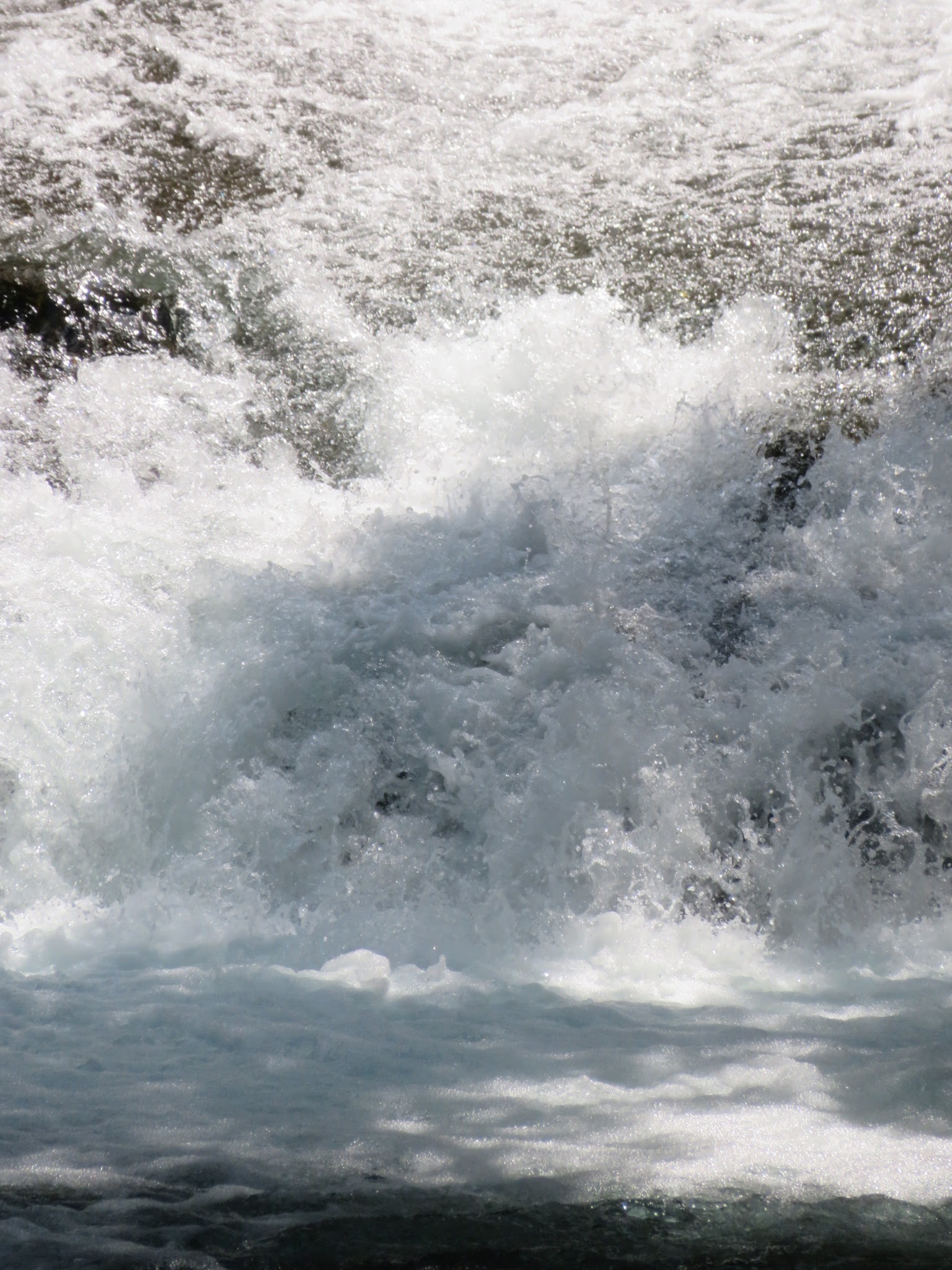 White water of the Amagi gorge surging over dark rock